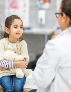 Doctor treating children