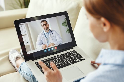 Woman having video call with a doctor.