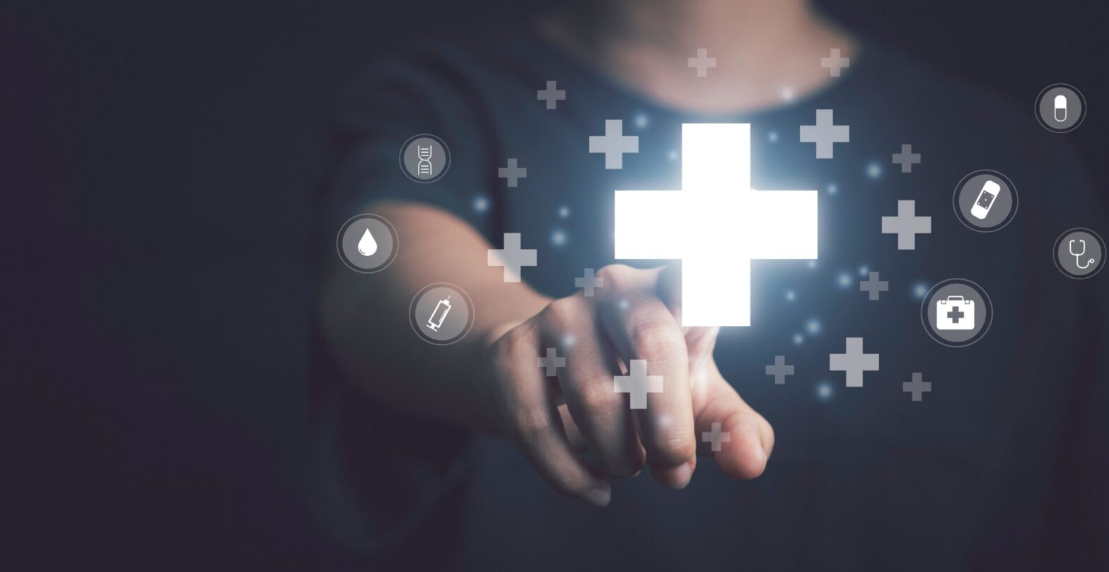 Person interacting with digital medical icons.